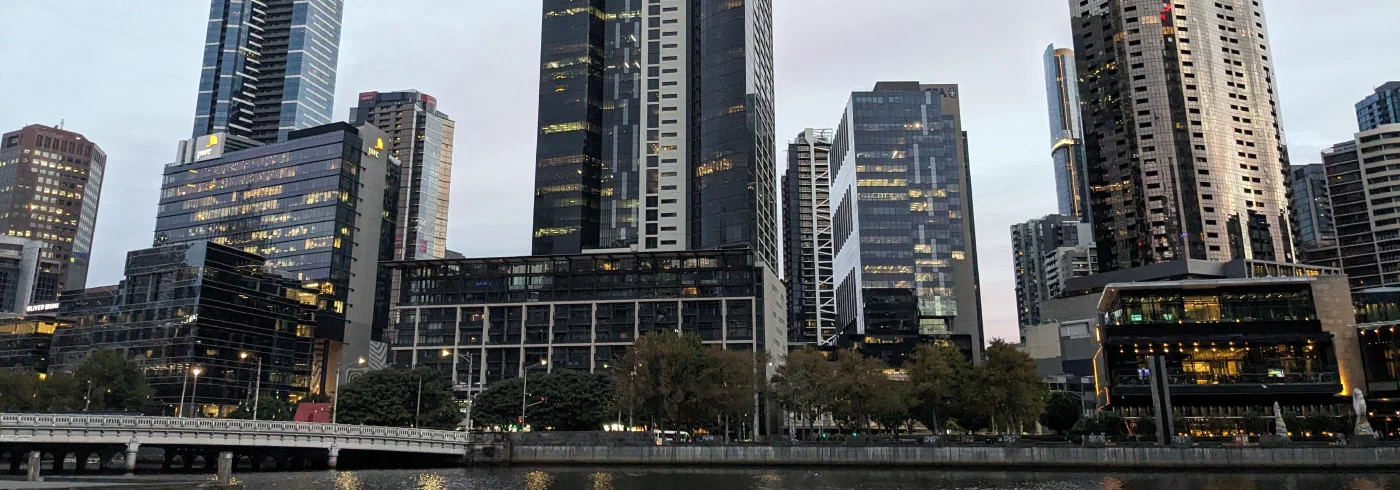 Melbourne's Southbank skyscrapers rising above the Yarra River in daylight