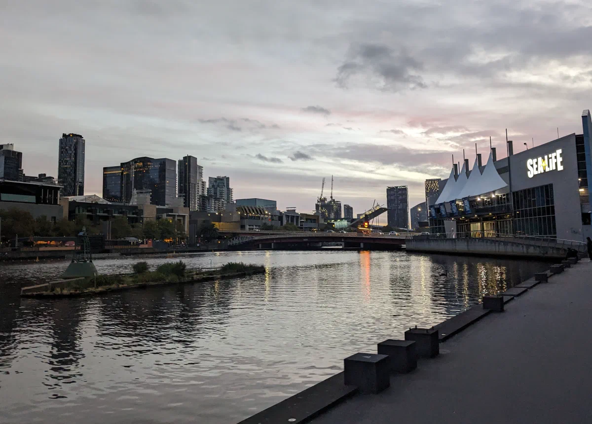 Melbourne's riverside skyline glowing at dusk along the Yarra